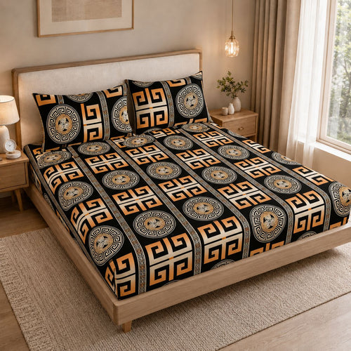 A bed dressed in a black bedding set with a bold geometric and medallion pattern in beige, white, and orange, styled in a warm, modern bedroom setting.
