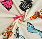 Close-up of fabric with colorful butterfly patterns