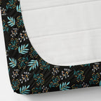 Fitted sheet with floral pattern on a mattress corner