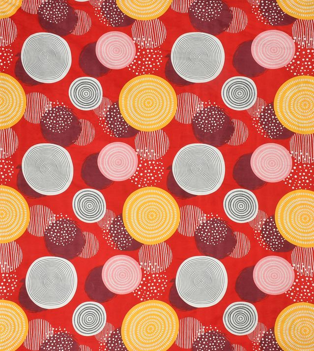 Pattern of circles and dots on a red background